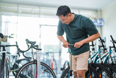 Side view of man riding bicycle