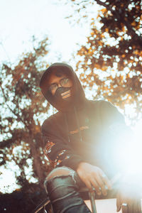 Portrait of young man against plants