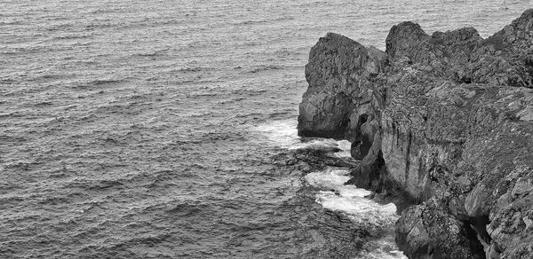 High angle view of rock formations on shore