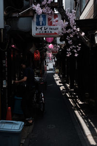 Man and woman on bicycle at store