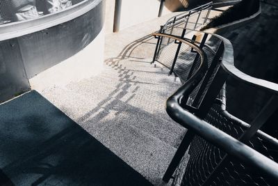 High angle view of bicycle on railing in city