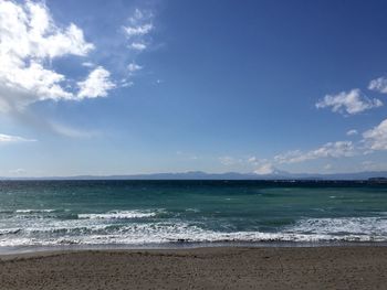 Scenic view of sea against cloudy sky