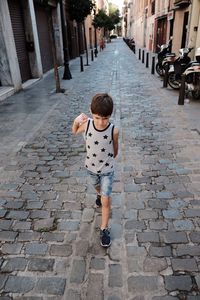 Girl walking on street in city