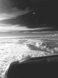 Low angle view of cropped car against sky