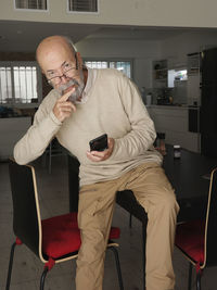 Portrait of young man using mobile phone