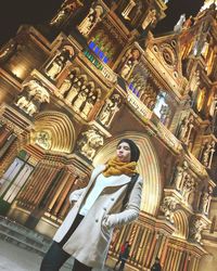 Low angle view of statue against building