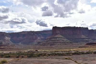 Scenic view of mountain against cloudy sky