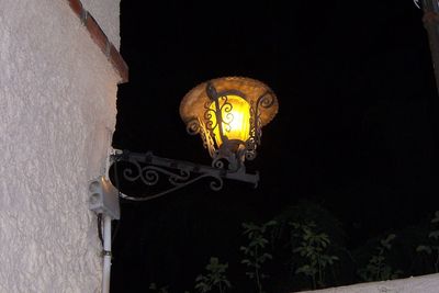 Low angle view of lamp post at night