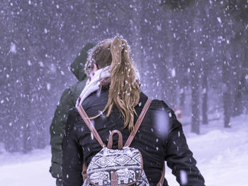 Rear view of woman in snow