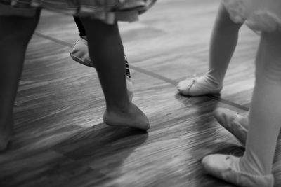 Low section of woman standing on tiled floor