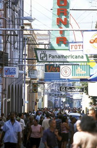 People amidst buildings in city