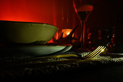 Close-up of wine glasses on table