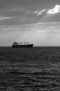 Ship sailing on sea against sky