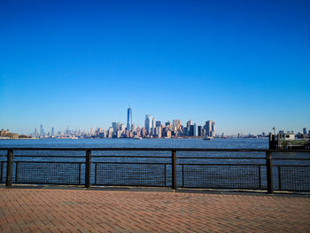 Buildings against clear blue sky