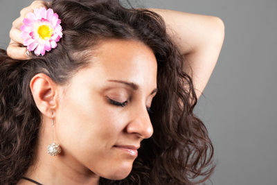 Close-up portrait of a beautiful woman over white background