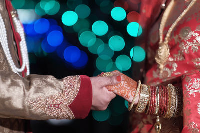 Indian couple holding hand each other