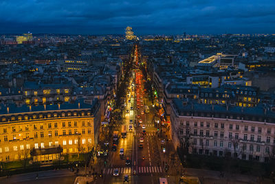 High angle view of illuminated buildings in city at night
