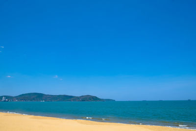 Scenic view of sea against blue sky