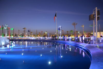 View of swimming pool at night