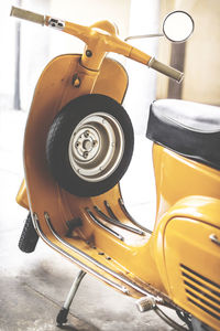 Close-up of yellow machine on table