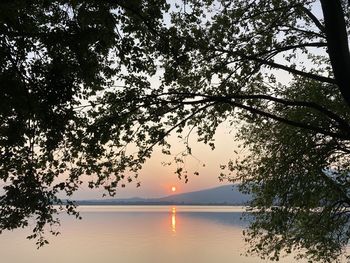 Scenic view of lake against sky during sunset