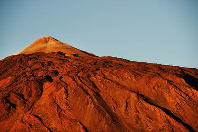 Scenic view of rocky mountain at el teide national park against clear sky