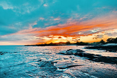 Scenic view of sea against sky during sunset