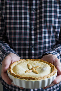 Close-up of hand holding pie