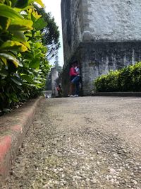 Man walking by wall