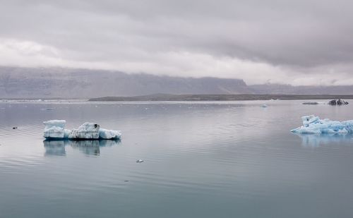 Scenic view of sea against sky during winter