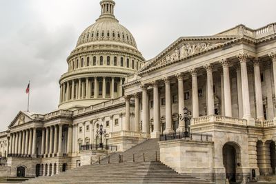 Low angle view of capital against sky