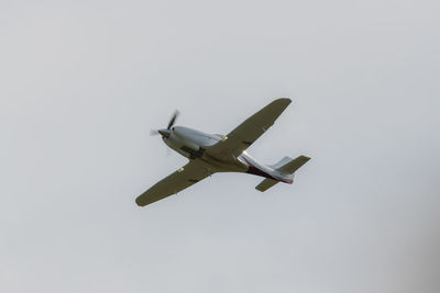 Low angle view of airplane flying in sky