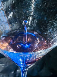 Close-up of water splashing in glass