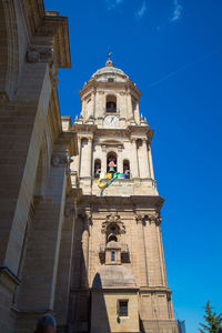 Low angle view of building against blue sky