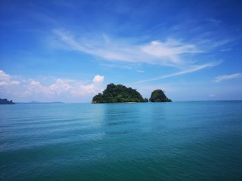 Scenic view of sea against blue sky