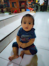 Portrait of cute baby girl at home