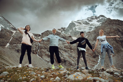 A group of friends climbed high in the mountains