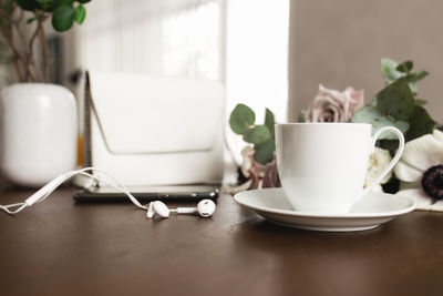 Close-up of coffee cup on table