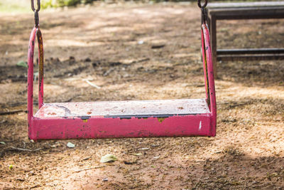 Close-up of empty swing in park