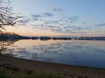 Scenic view of lake against sky during sunset
