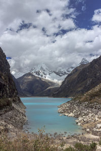 Scenic view of lake and mountains against sky