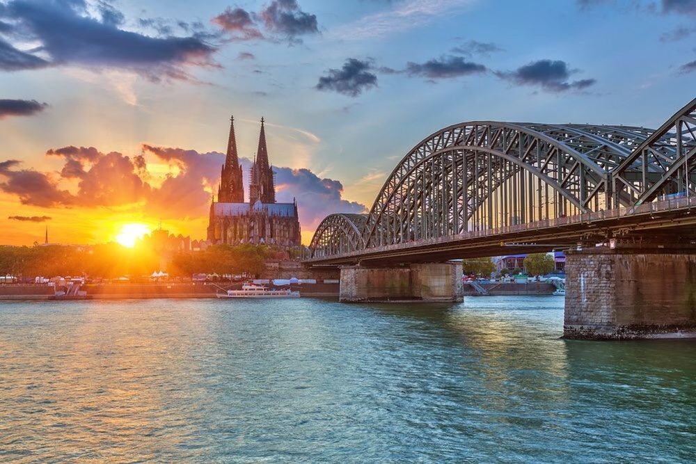 architecture, built structure, famous place, international landmark, connection, building exterior, bridge - man made structure, travel destinations, river, water, capital cities, travel, tourism, sunset, city, waterfront, engineering, thames river, sky, transportation