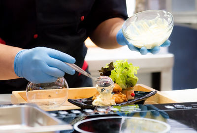 Midsection of man preparing food