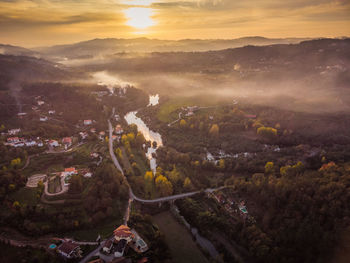 High angle view of townscape against sky during sunset