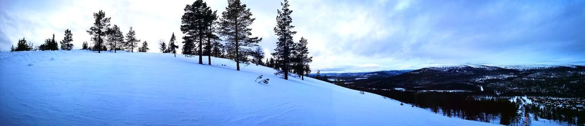 Scenic view of snow covered mountain against sky