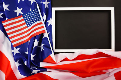 Close-up of flag against blue wall