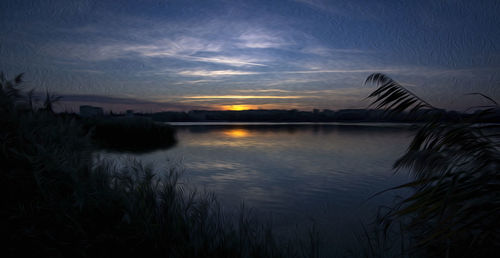 Scenic view of lake against sky during sunset