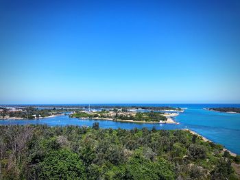 Scenic view of sea against clear blue sky