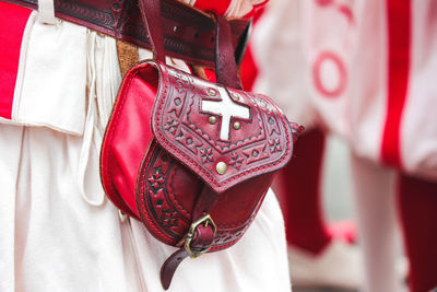 Close-up of clothes hanging on white fabric