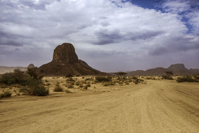 Rock formations on landscape against sky